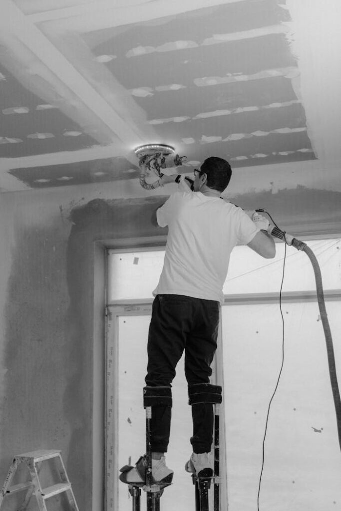 pexels-photo-6474349 Professional polish a ceiling in a black and white construction site setting.